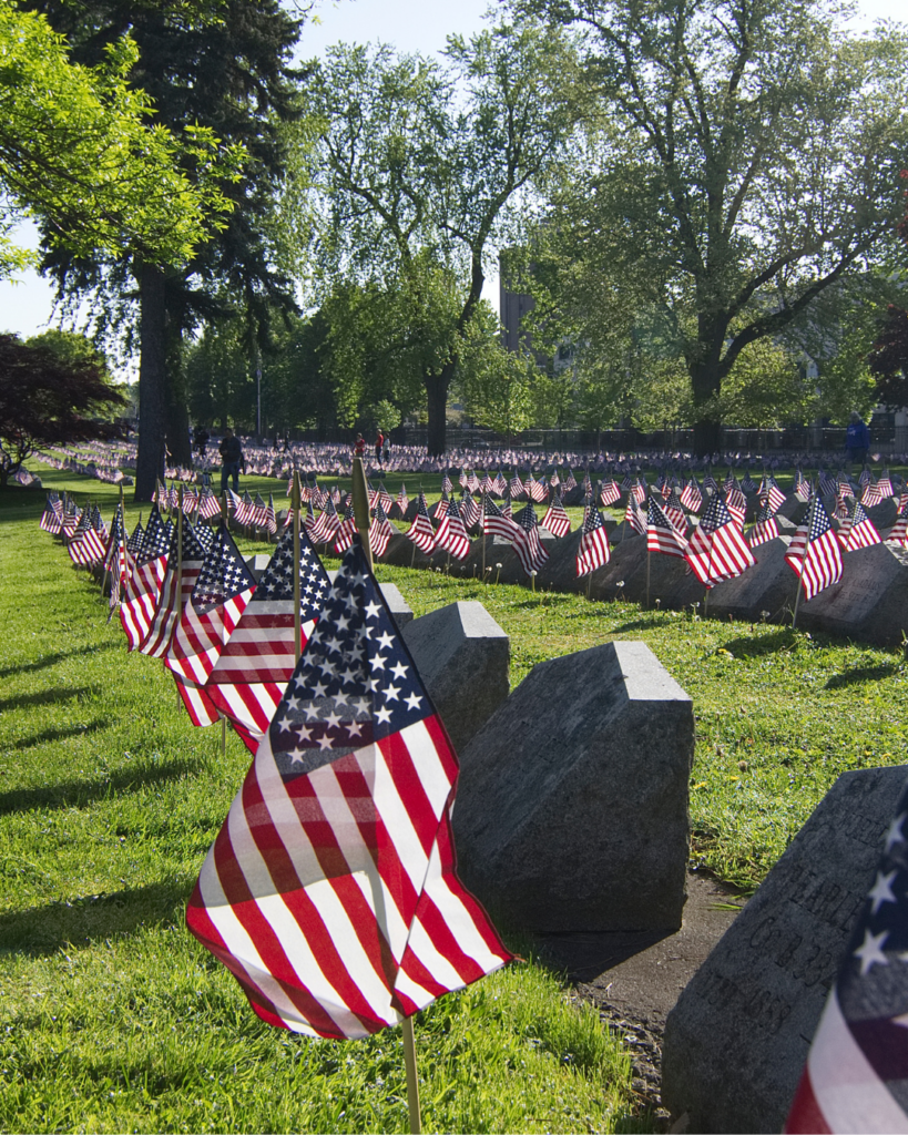 American flags at gravesites during community service projects