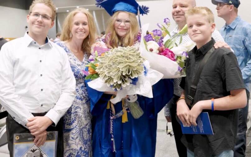 2025 ISWA student graduate with family