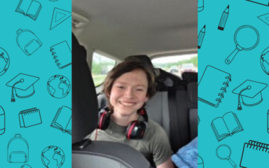 Cody in the backseat of car smiling