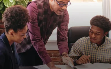 Teacher explaining to his students