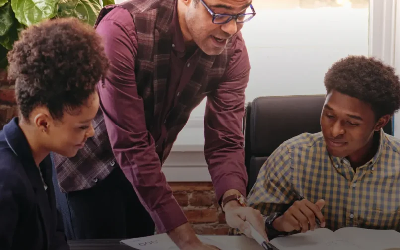 Teacher explaining to his students