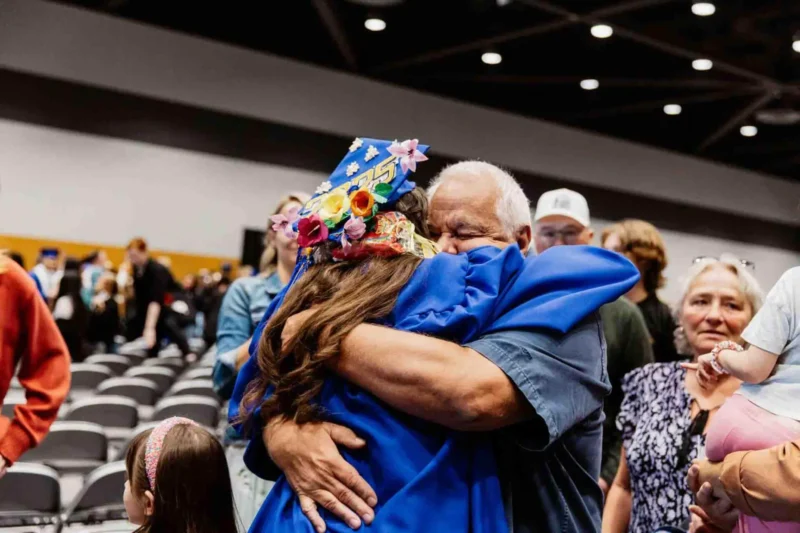 Student hugging her father