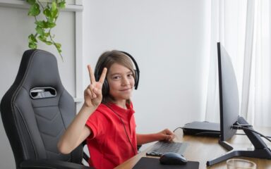 boy smiling and using the computer