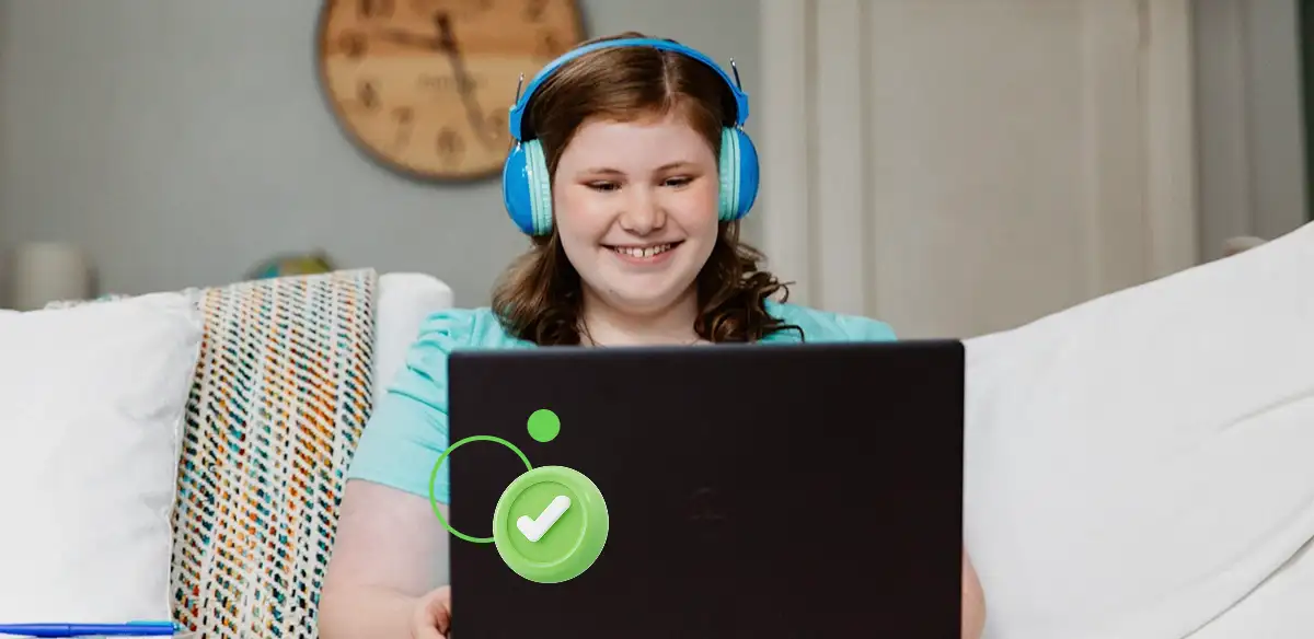 Student wearing a blue pair of headphones